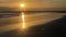 Dawn at sea, morning on the beach, orange dawn. Waves on a sandy tropical beach