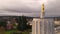 Dawn sun shines through clouds at the State Capital Building in Salem