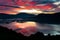 Dawn of time epic sunrise across Derwentwater from Catbells towards Keswick, Skiddaw and Blencathra with the skies on fire in the