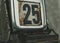 Day 25 number on metal rusty vintage calendar.