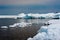 Day at Baikal Lake. Spring floating of ice