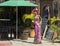 Day of the Dead skeleton holding a margarita and wearing women\'s clothing outside a restaurant in Todo Santos.