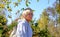 Day dreaming senior  woman outdoors. confident senior woman looking thoughtful during  walking countryside