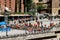 Day hikers in red who made it to to the  plaza at Santa Maria de Montserrat abbey in Monistrol, Catalonia, Spain