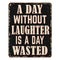 A day without laughter is a day wasted vintage rusty metal sign