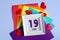 day of the month 19 June calendar . Calendar date in a white frame on a rainbow background