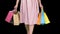 After day shopping Young woman carrying shopping bags while walking, Alpha Channel