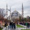 Day shot of Blue Mosque at crowded  Sultan Ahmed square at rainy winter day with tourists visiting the place, Istanbul, Turkey