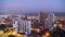 Day to Night Timelapse of City Space with Skyscrapers and Windows Changings Light. Batumi