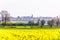 Day view of Northampton Town cityscape New Duston England, UK with canola field on foreground