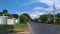 The day in which the sky is bright, with beautiful clouds and asphalt roads in villages with power lines along the road