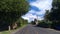 The day in which the sky is bright, with beautiful clouds and asphalt roads in villages with power lines along the road