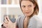 Daydreaming woman with coffee mug