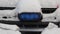 Daylight. police siren blue under the snow. Close-up.