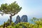 Daylight view of famous Faraglioni rocks from Capri island, Ital