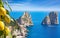 Daylight view of famous Faraglioni Rocks, Capri Island, Italy