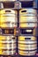 Daylight view to beer kegs on black plastic pallets