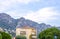 Daylight view to a hotel and big mountains in Beaulieu sur mer