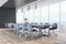 Daylit wooden and concrete meeting room interior with panoramic city view, daylight and large table with chairs. Corporate design