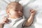 Daysleep Time. Closeup Portrait Of Adorable Little Newborn Baby Sleeping On Bed