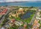 Daytime aerial photo of the Palace of Fine Arts, in San Francisco, California, USA. The Golden Gate Bridge is in the background.