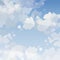 Daytime blue sky background with cartoon clouds