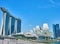 Daytime cityscape of Marina Bay in Singapore with a view of a hotel and Helix bridge.