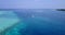 Daytime flying island view of a sandy white paradise beach and turquoise sea background in best quality 4K