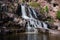 Daytime long exposure of Gooseberry Falls waterfalls at the state park in Minnesota in summer