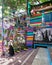 Daytime shot of cafe decorated with multicolored panels, movie poster, and stairs, in Balat District, Istanbul, Turkey