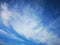 Daytime sky with feathery and layered clouds. Blue sky. Summer sky. Beautiful and whimsical shape of clouds