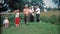 DAYTON, OHIO 1948: Shirtless men playing family baseball in farm fields.