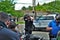 Dayton, Ohio United States 05/30/2020 police officers putting on gas masks preparing to deploy OC pepper spray and tear gas at a