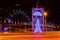 Dazzling Christmas tree surrounded by the dance of light trails from traffic in the city centre of Riga.