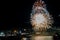 Dazzling fireworks over Aberdeen cityscape in a dark night sky