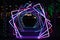 Dazzling neon display of rotating squares illuminates the night sky