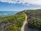 De Hoop Nature Reserve - Walking path leading through the sand dunes at the ocean with coastal vegetation