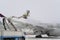 De-icing the aircraft before the flight. The deicing machine sprinkles the wing of a passenger plane with antifreeze. Winter at