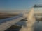 De-icing airplane wing before take off