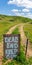 Dead End Keep Out Sign On Wire Fence At Dirt Road