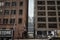 Dead end street at the bottom of skyscrapers in downtown Toronto, ontario, Canada, in the CBD. with delivery trucks in foreground