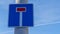 Dead end street road sign on blue sky background. A street sign indicates to drivers that the road is a dead end.