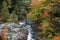 Dead river through rocky terrain in Michigan Upper Peninsula with colorful fall foliage