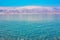 Dead sea landscape soft focus calm water surface and mountain foggy background scenic view Middle East Israeli resort destination