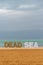 Dead Sea statue with the Dead Sea and clouds on a Winter`s day, Great photo opportunity for tou