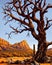 Dead tree with bare branches in desert landscape, generative ai