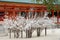 Dead tree branches with paper prayer strips at Heian Shrine.