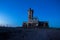 Dead trees in the abandoned city of Epecuen. Famous building to slaughter cattle. Sign that says