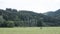 Dead trees and hay bales in valley between La Roche and Hotton in the belgian ardennes