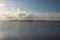 Dead trees in middle of Yellow Cotton Bay deep in southern Louisiana on sunny day with thick clouds